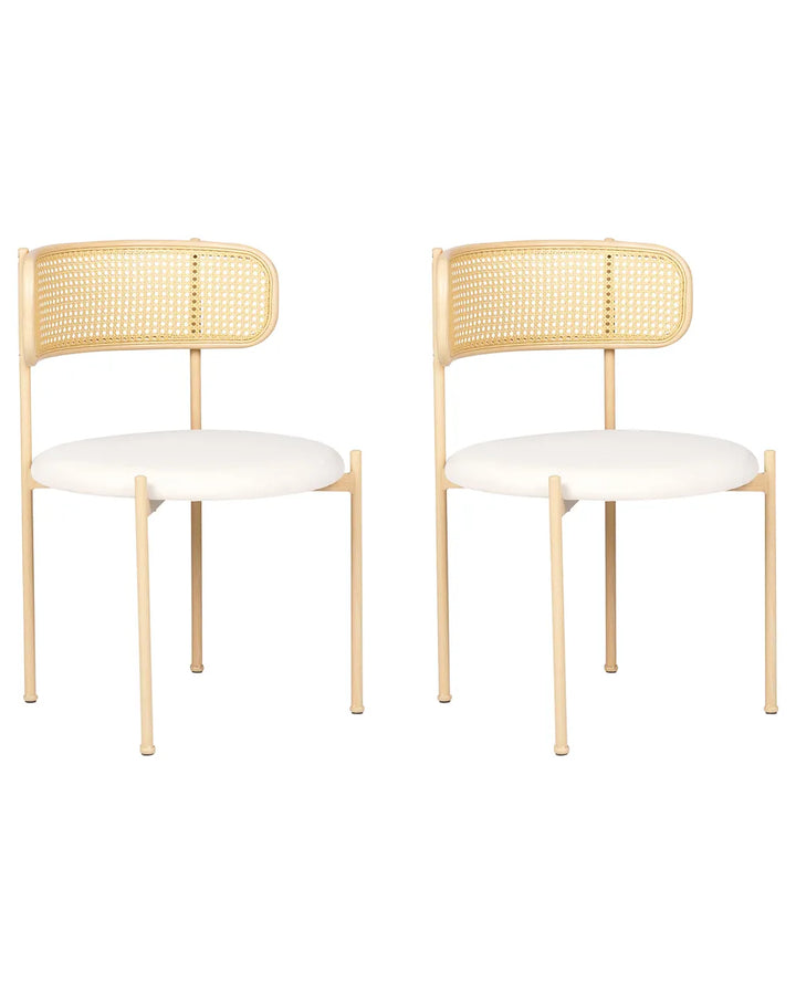 Two matching dining chairs with light natural wood frames, woven cane backrests, and off-white upholstered seats, shown on a plain white background.
