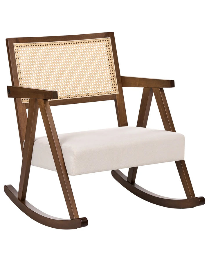 Wooden rocking chair with wicker backrest and white cushion on a white background