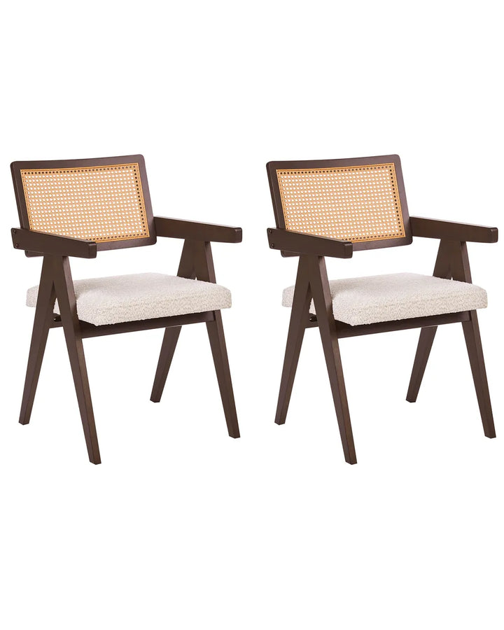 Two matching wooden dining armchairs with woven cane backrests and cream upholstered seats, shown on a plain white background.