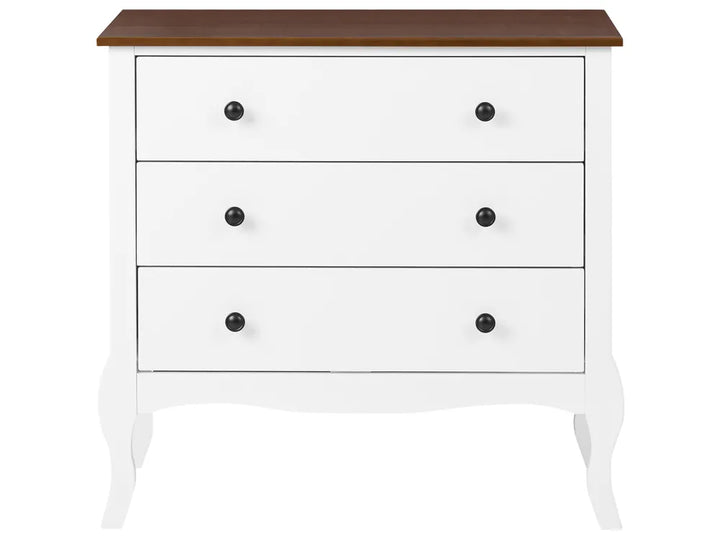 A three-drawer chest of drawers with a white painted body, a medium brown wooden top, and small round black knobs, shown against a plain white background.