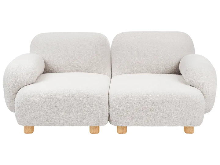 A modern two-seater sofa upholstered in a textured boucle fabric in a light cream color, with light wood legs, shown against a plain white background.