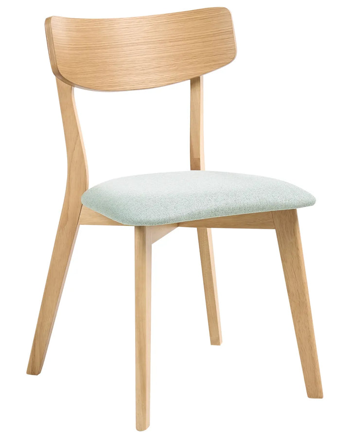 Wooden chair with a light green cushion on a white background