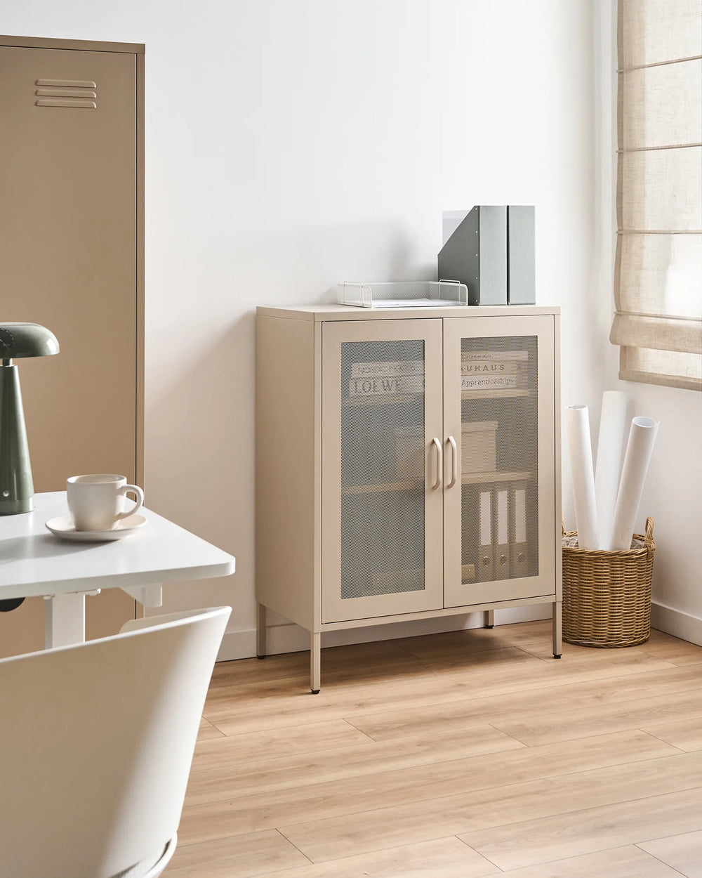 Beige storage cabinet with glass doors in a room with a desk and chair.