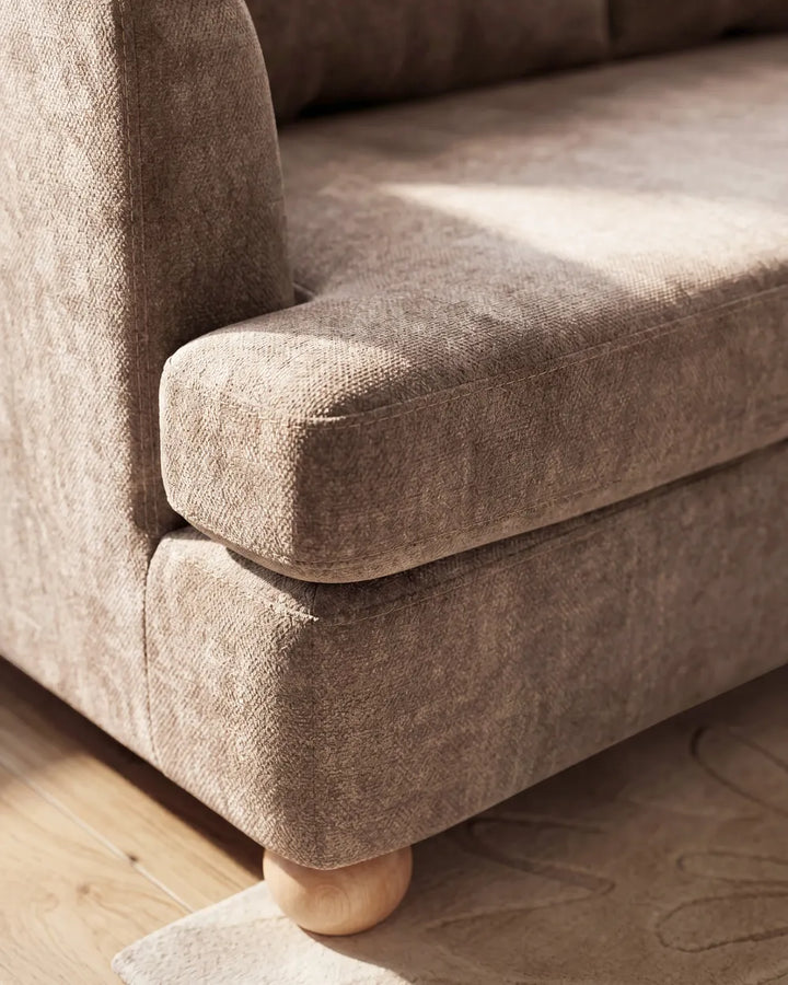 Modern brown fabric sofa with cushions