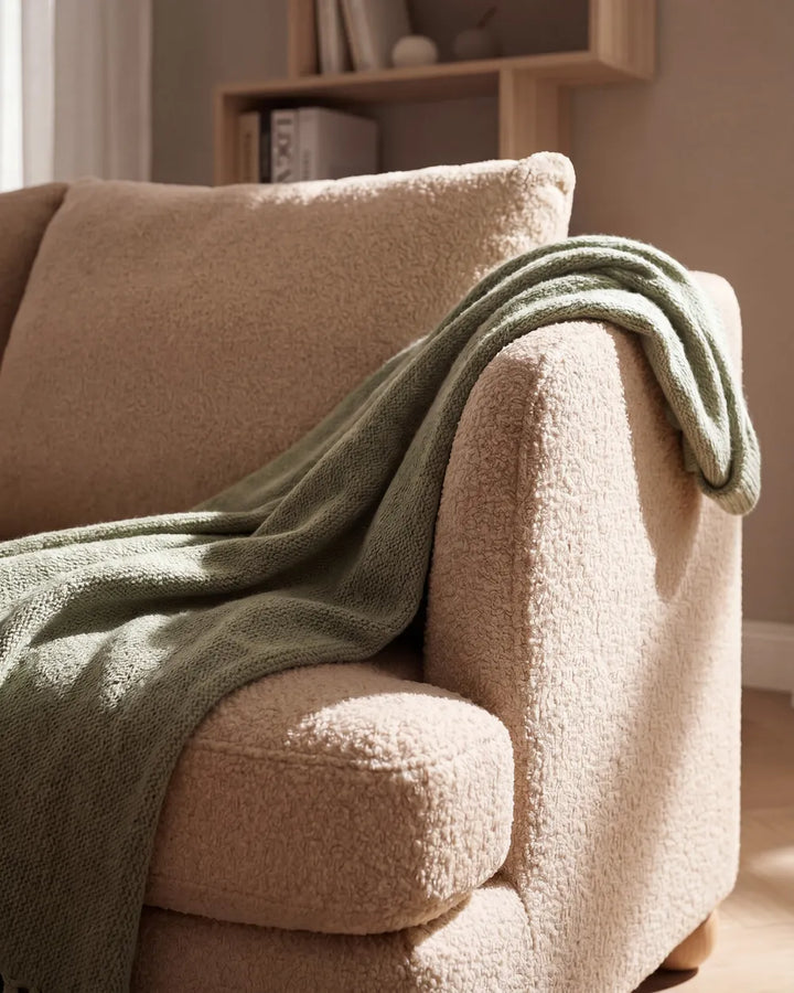 Modern beige boucle sofa with cushions