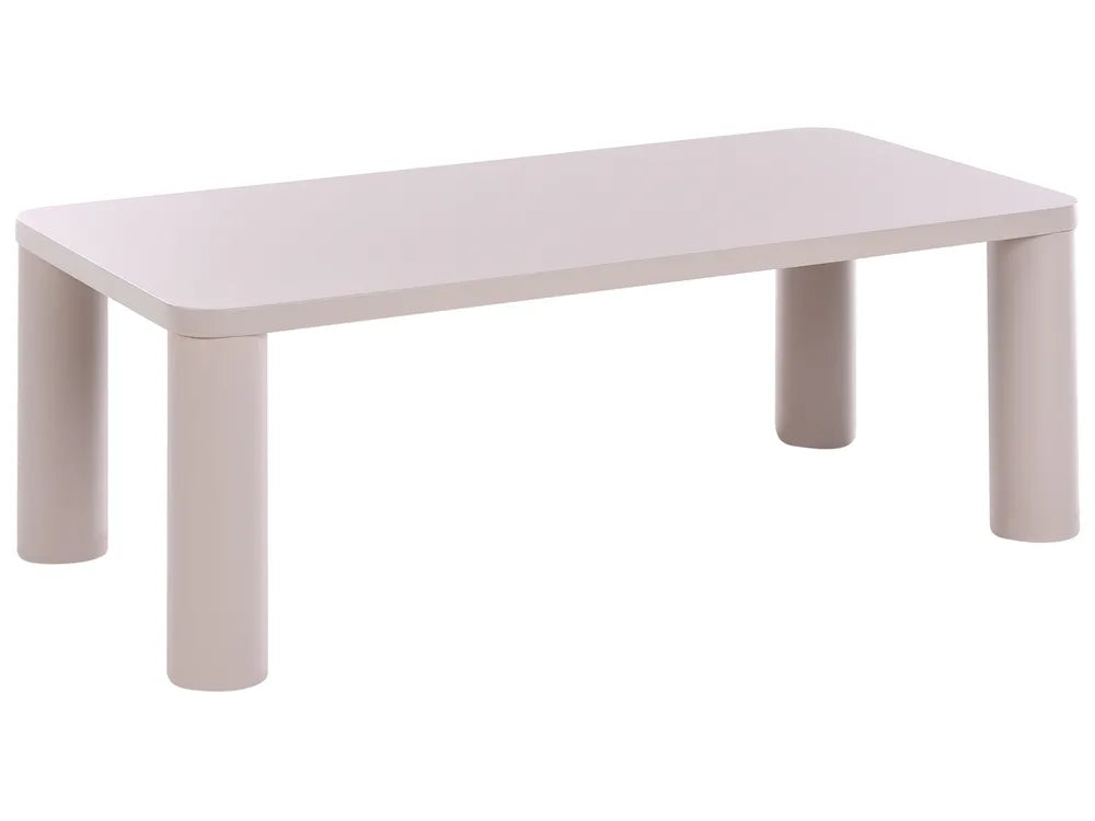 A minimalist rectangular table with rounded corners and four thick cylindrical legs, shown in a light warm gray or pale blush tone against a plain white background.