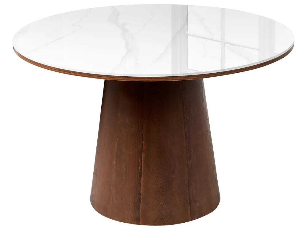 A round dining table featuring a white marble-patterned top and a tapered dark brown wooden pedestal base, shown against a plain white background.