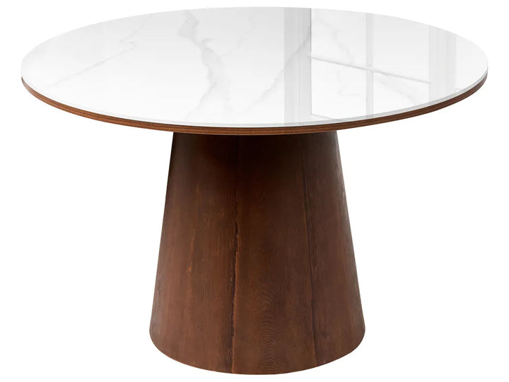 A round dining table featuring a white marble-patterned top and a tapered dark brown wooden pedestal base, shown against a plain white background.