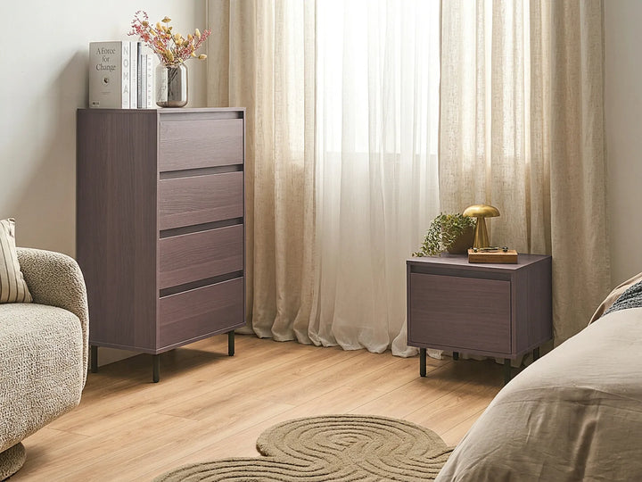 Modern bedroom with wooden dresser and nightstand against a curtain backdrop