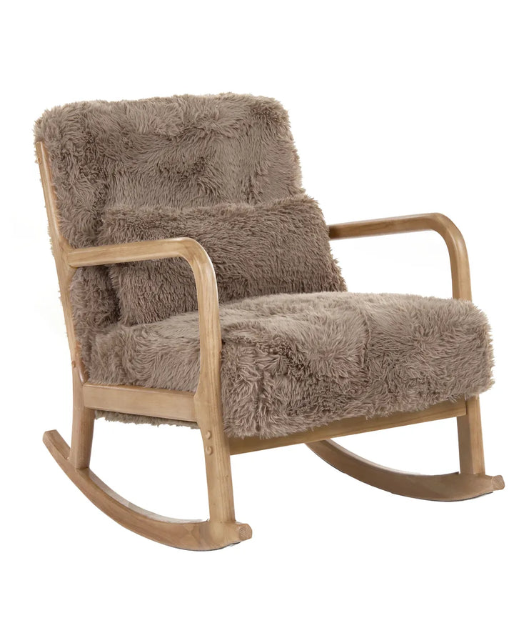 A rustic wooden rocking chair upholstered in a thick, shaggy taupe-brown faux fur or sheepskin material, shown against a plain white background.