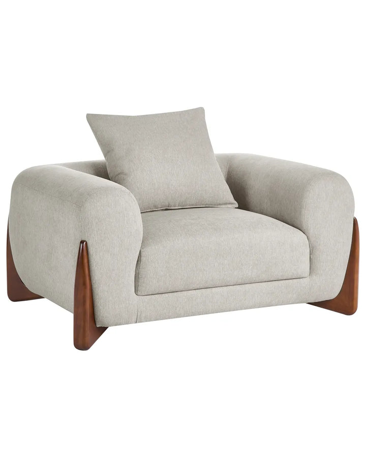 A modern armchair with a light beige textured fabric upholstery, a matching back cushion, and dark brown wooden legs, shown against a plain white background.