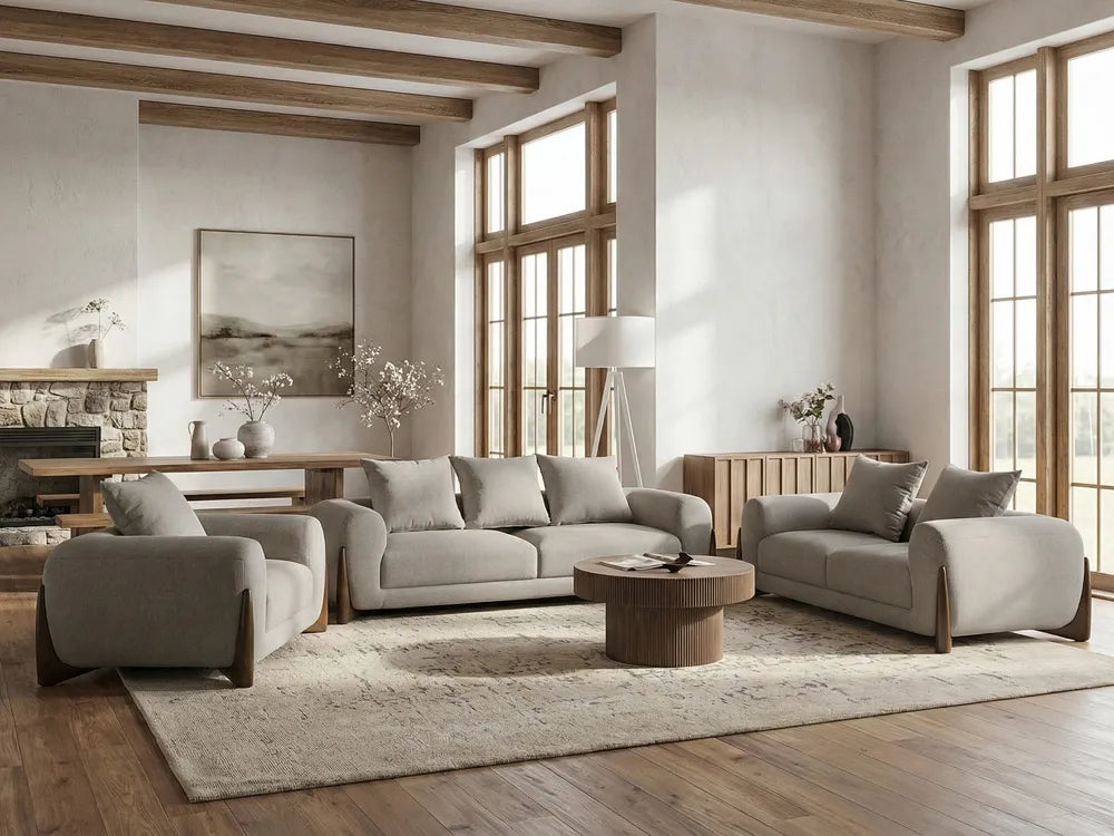 Modern living room with gray sofa, armchair, and coffee table in a well-lit room.