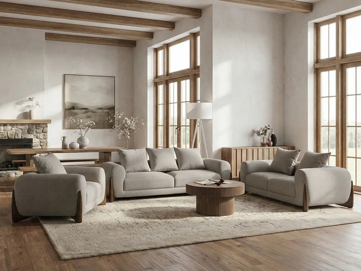 Modern living room with gray sofa, armchair, and coffee table in a well-lit room.