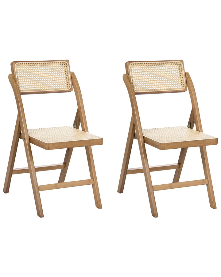 Two light natural wood folding chairs with woven cane backrests, shown side by side on a plain white background.