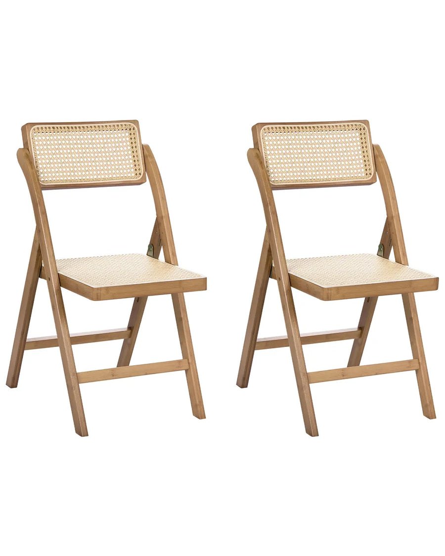 Two light natural wood folding chairs with woven cane backrests, shown side by side on a plain white background.