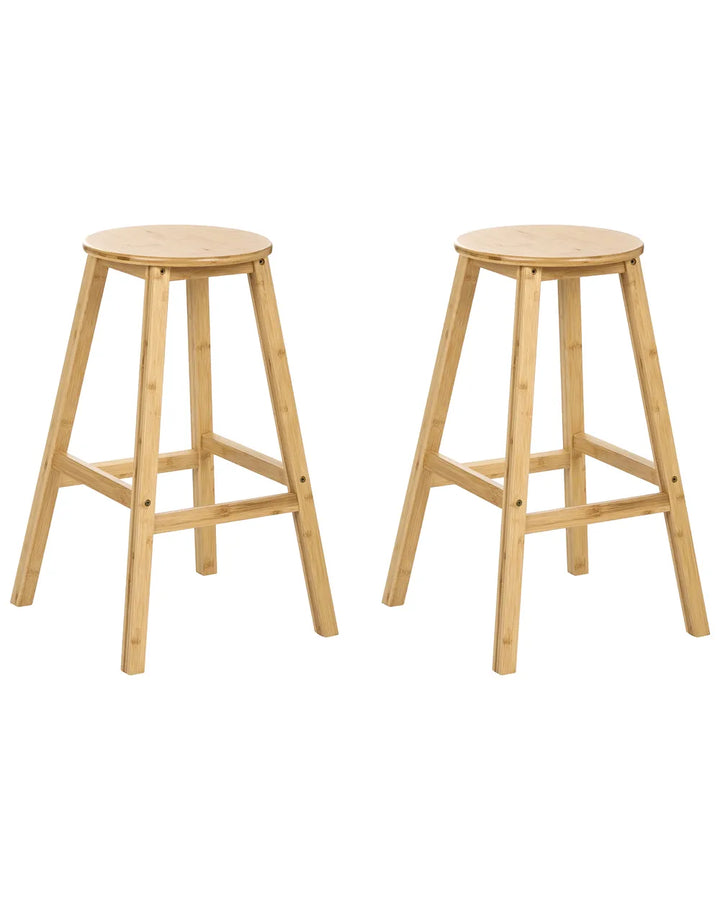 Two light natural wood bar stools with round seats and four angled legs, shown on a plain white background.