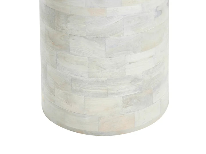 Round side table with a white marble-like pattern on a white background