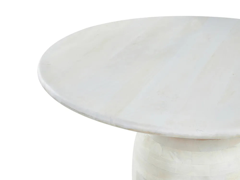 Round marble table with a white background