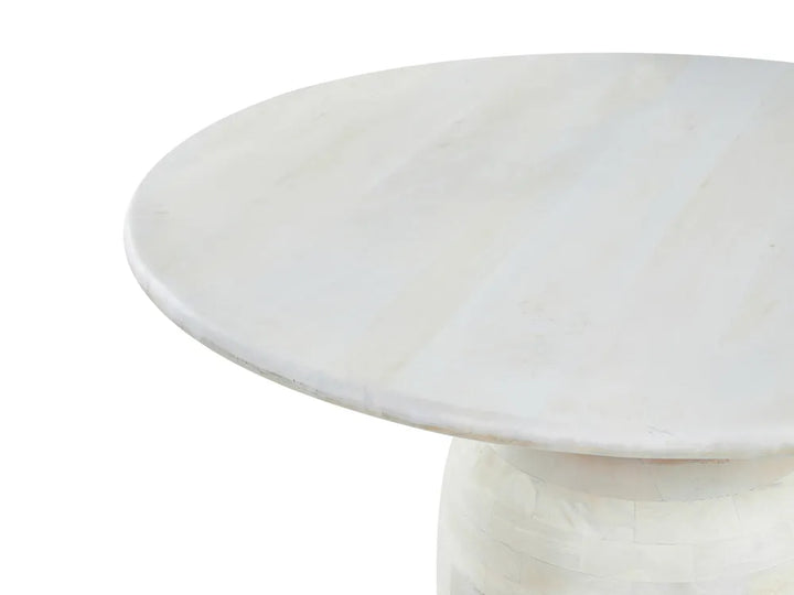 Round marble table with a white background