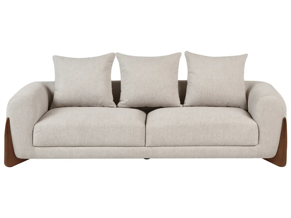 A modern three-seat sofa with light beige textured upholstery, three matching back cushions, and dark brown wooden legs, shown against a plain white background.