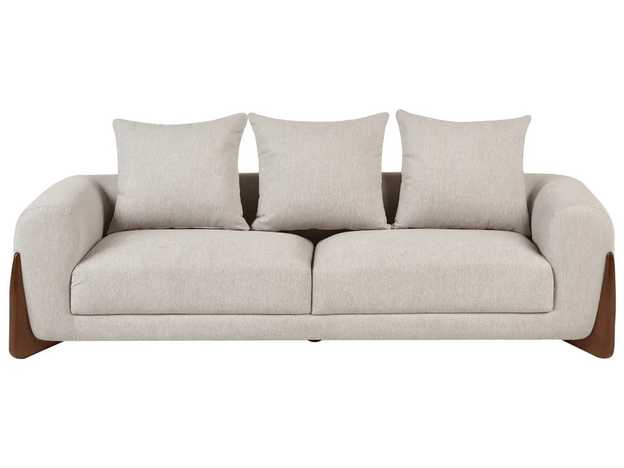 A modern three-seat sofa with light beige textured upholstery, three matching back cushions, and dark brown wooden legs, shown against a plain white background.