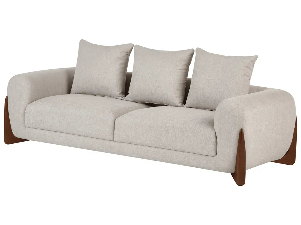A modern three-seat sofa upholstered in a light beige textured fabric, featuring three matching back cushions and dark brown wooden legs, shown against a plain white background.