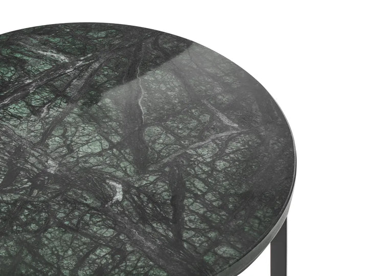 Close-up of a round table top with a polished dark green and black marble pattern, set against a plain white background.