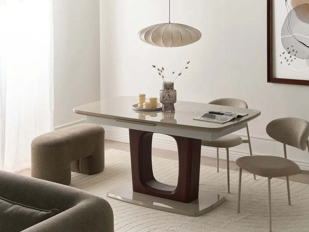 Dining room with a modern table and chairs in a well-lit room.