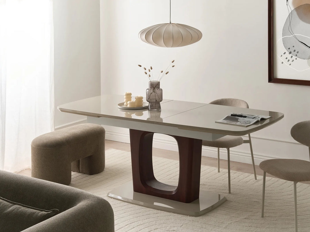 Modern dining room with a gray dining table and chairs in a well-lit room.