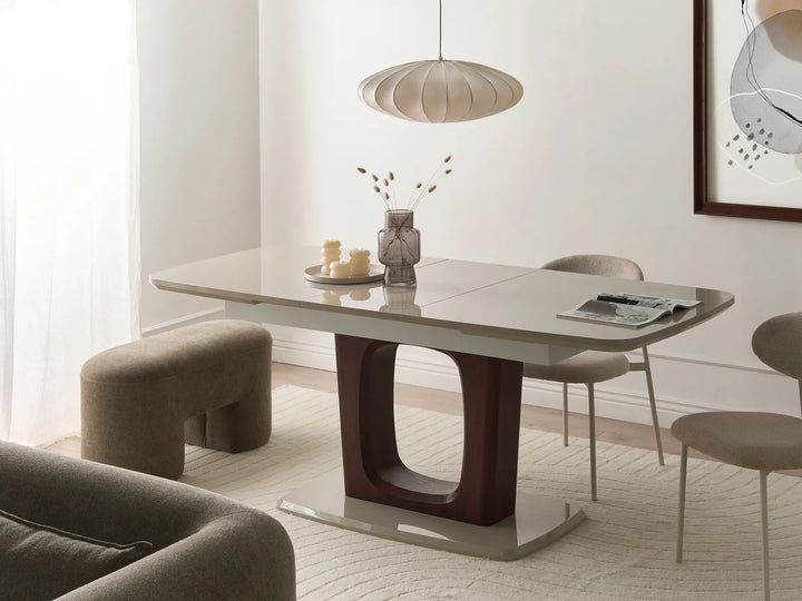 Modern dining room with a gray dining table and chairs in a well-lit room.