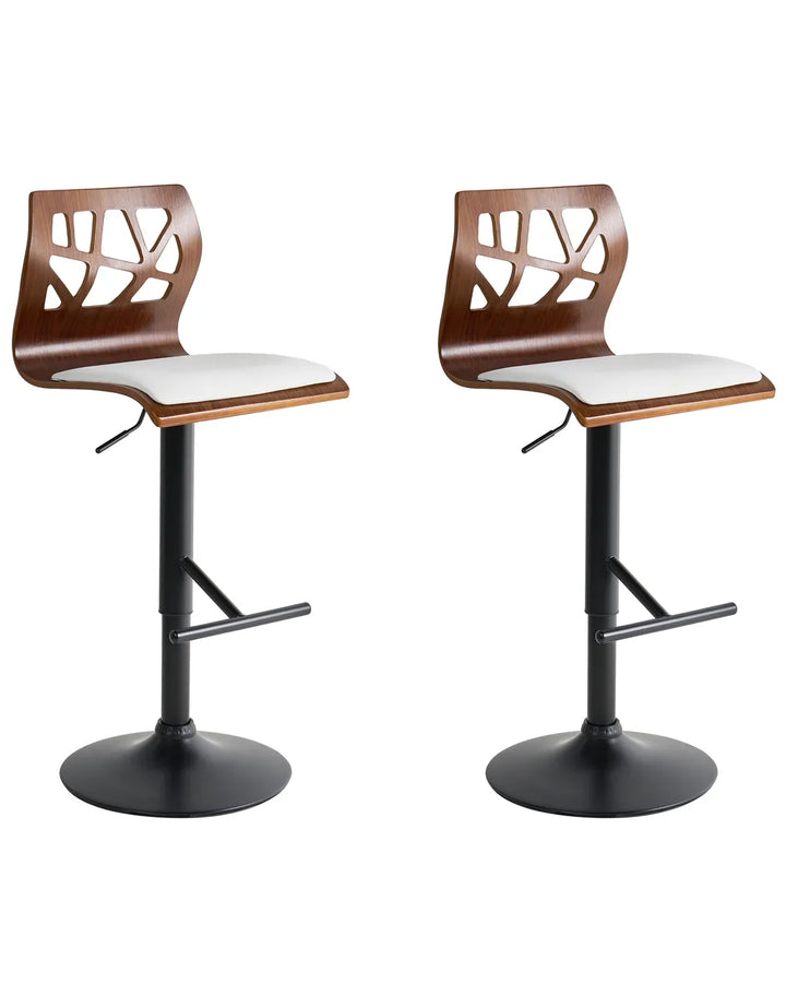 Two wooden bar stools with white seats on a white background