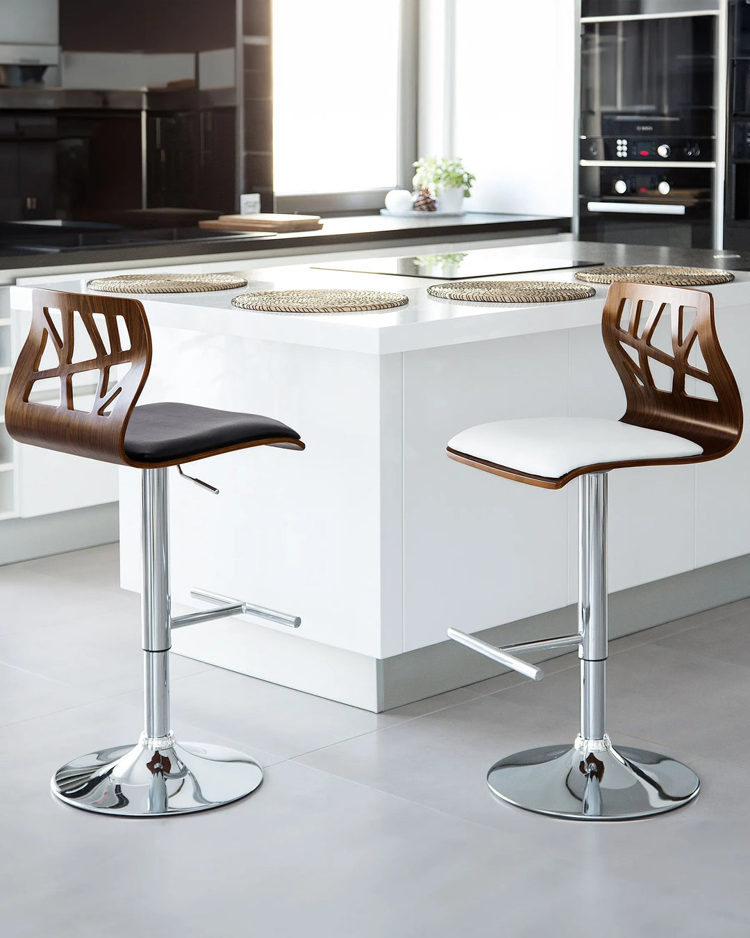 Two bar stools with wooden seats and chrome bases in a modern kitchen setting.
