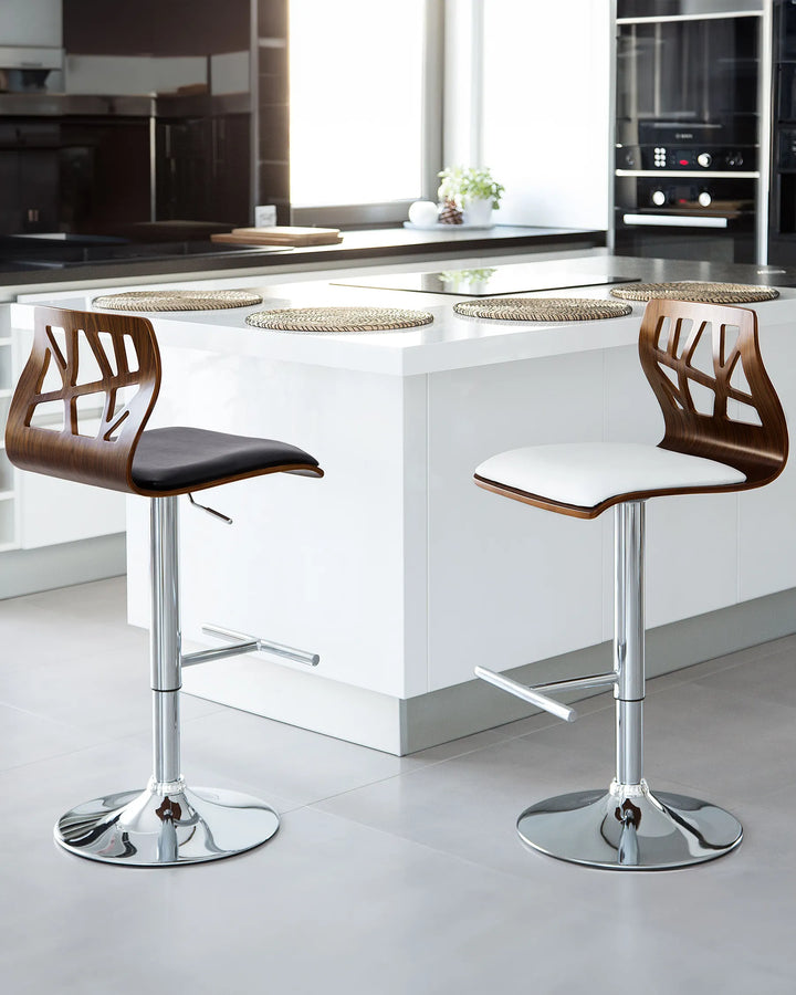 Two bar stools with wooden seats and chrome bases in a modern kitchen setting.