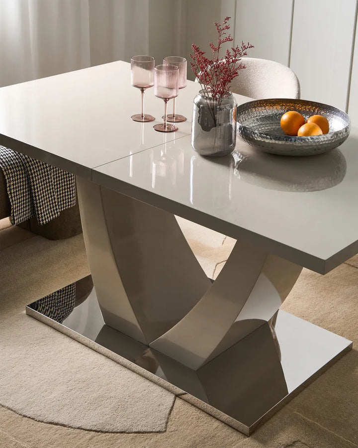 Modern dining table with decorative items in a room setting