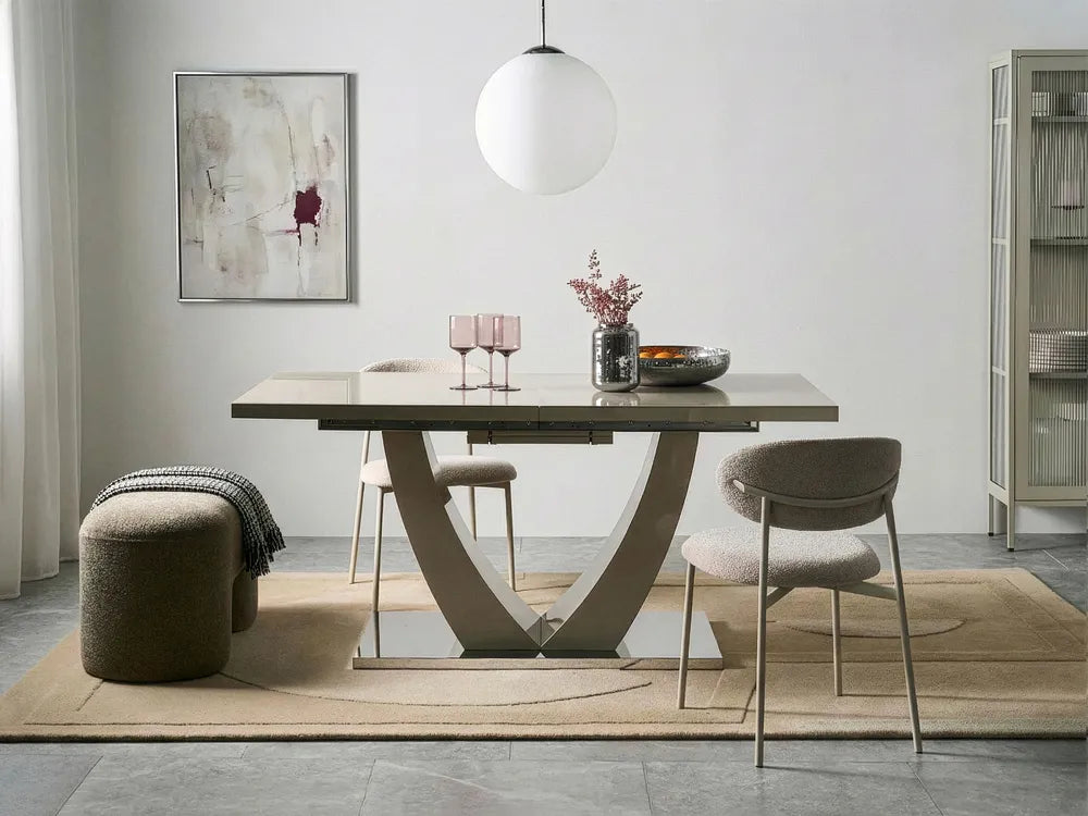 Modern dining room with a table, chairs, and decor elements.