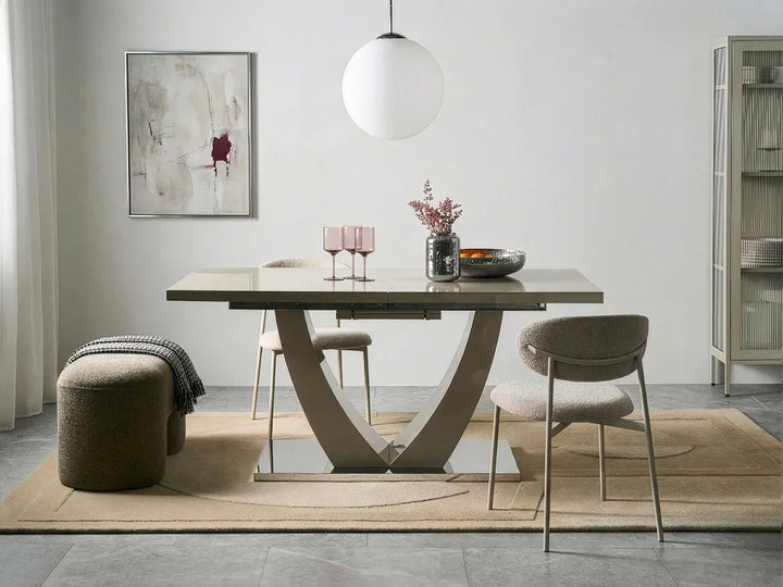 Modern dining room with a table, chairs, and decor elements.