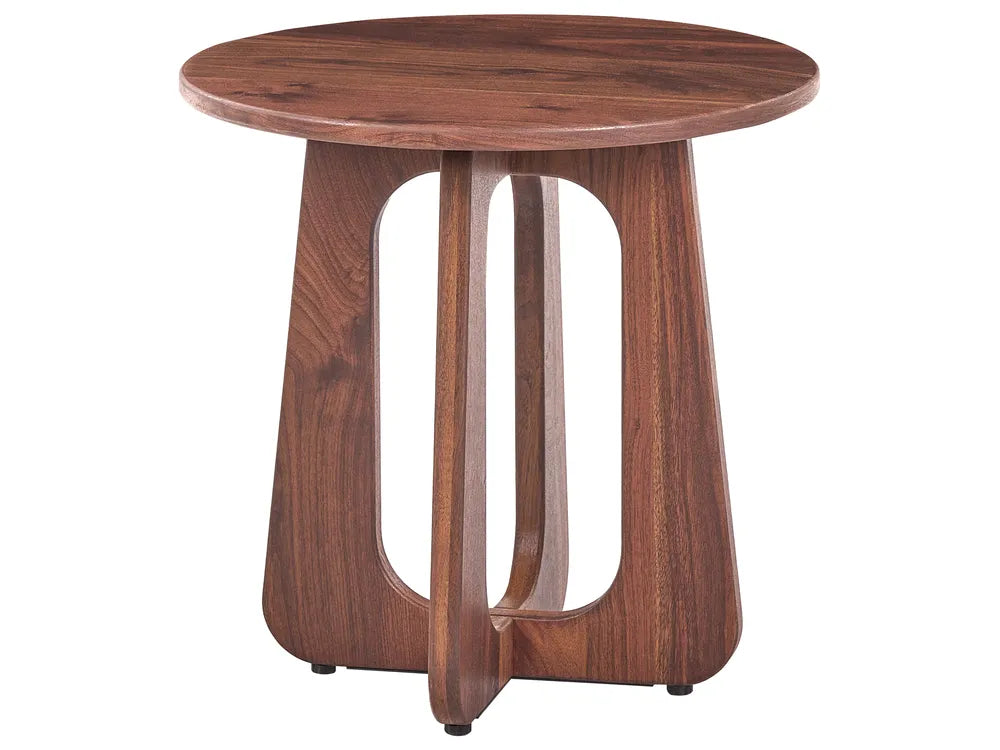 A round wooden side table with a medium brown walnut finish, featuring a sculptural three-legged base with open center panels, shown on a plain white background.