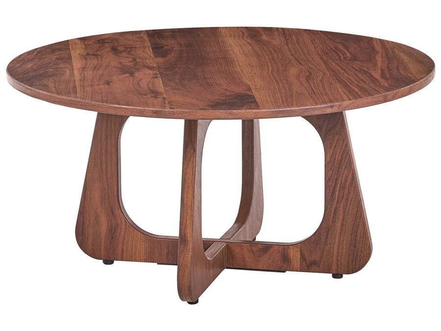 A round wooden coffee table with a rich medium-brown walnut finish, featuring a sculptural curved base with open cutouts, shown on a solid white background.