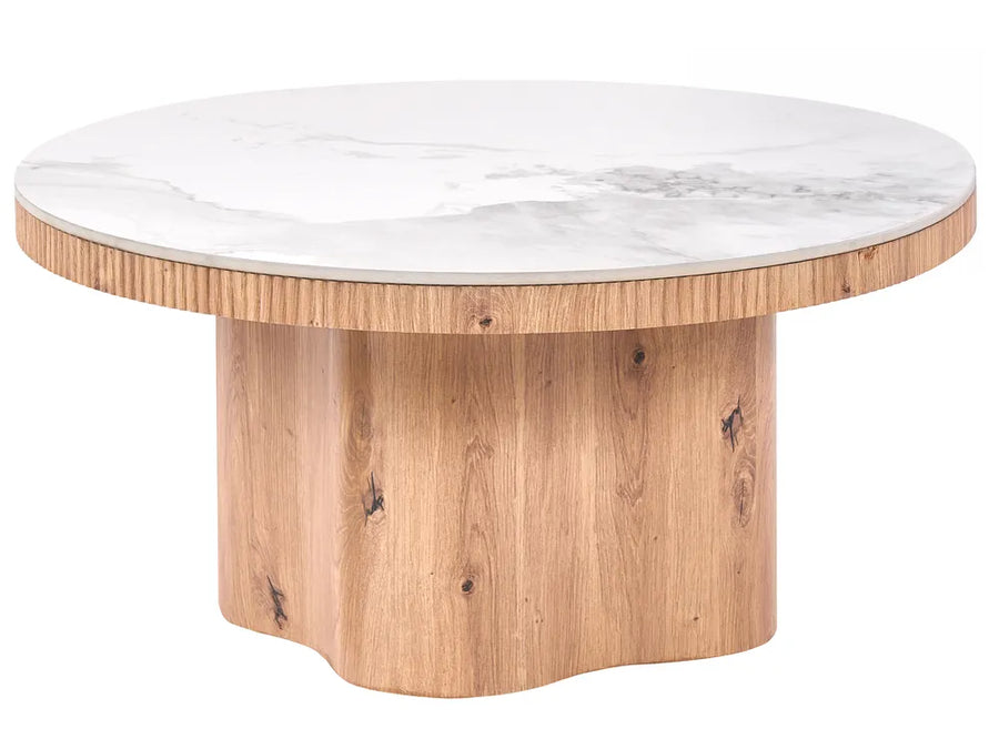 A round coffee table with a white marble top featuring gray veining and a natural light wood fluted base, shown on a solid white background.