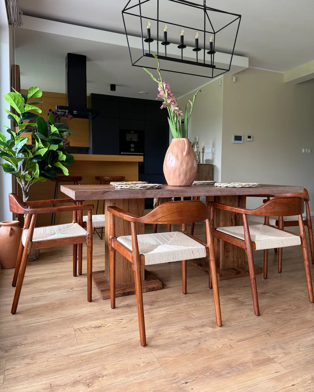 Dining room with wooden table and chairs on a wooden floor