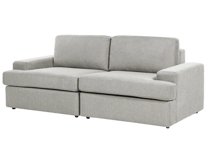 A light gray upholstered loveseat with a low-profile rectangular design, wide armrests, and two back cushions, shown on a plain white background.