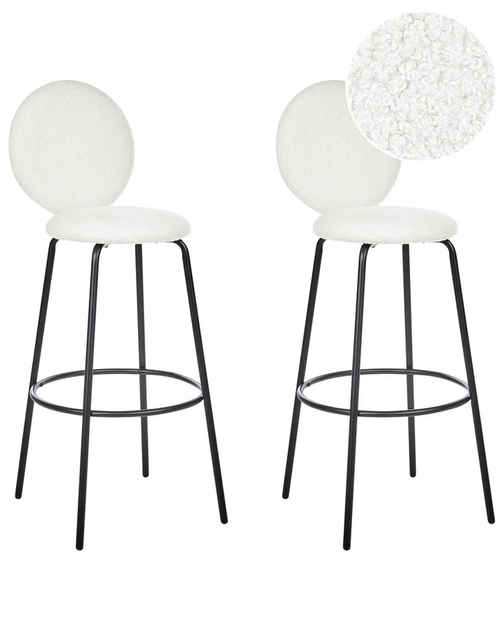 Two white bar stools with black legs on a white background