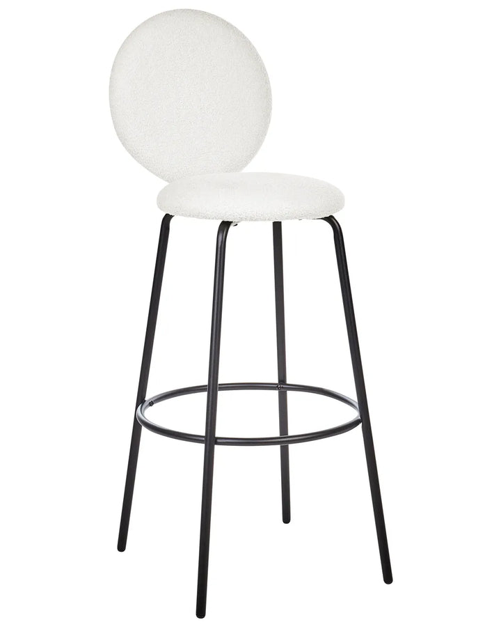 A modern bar stool with a round white upholstered seat and backrest, supported by a slim black metal frame with a footrest ring, shown on a plain white background.
