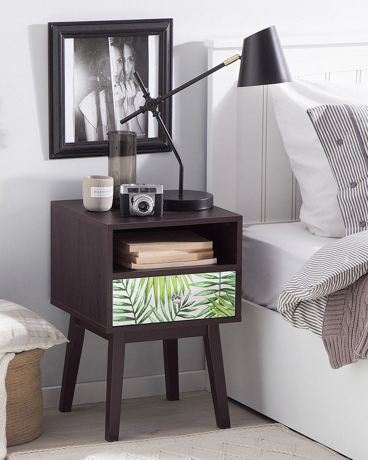 Wooden nightstand with decorative items in a bedroom setting