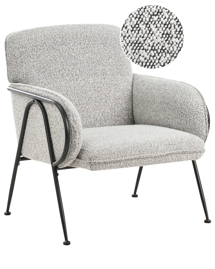 Gray upholstered armchair with black metal legs on a white background