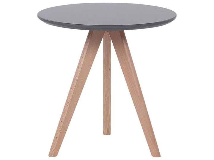 A round side table with a dark gray top and three light natural wood legs, shown against a plain white background.