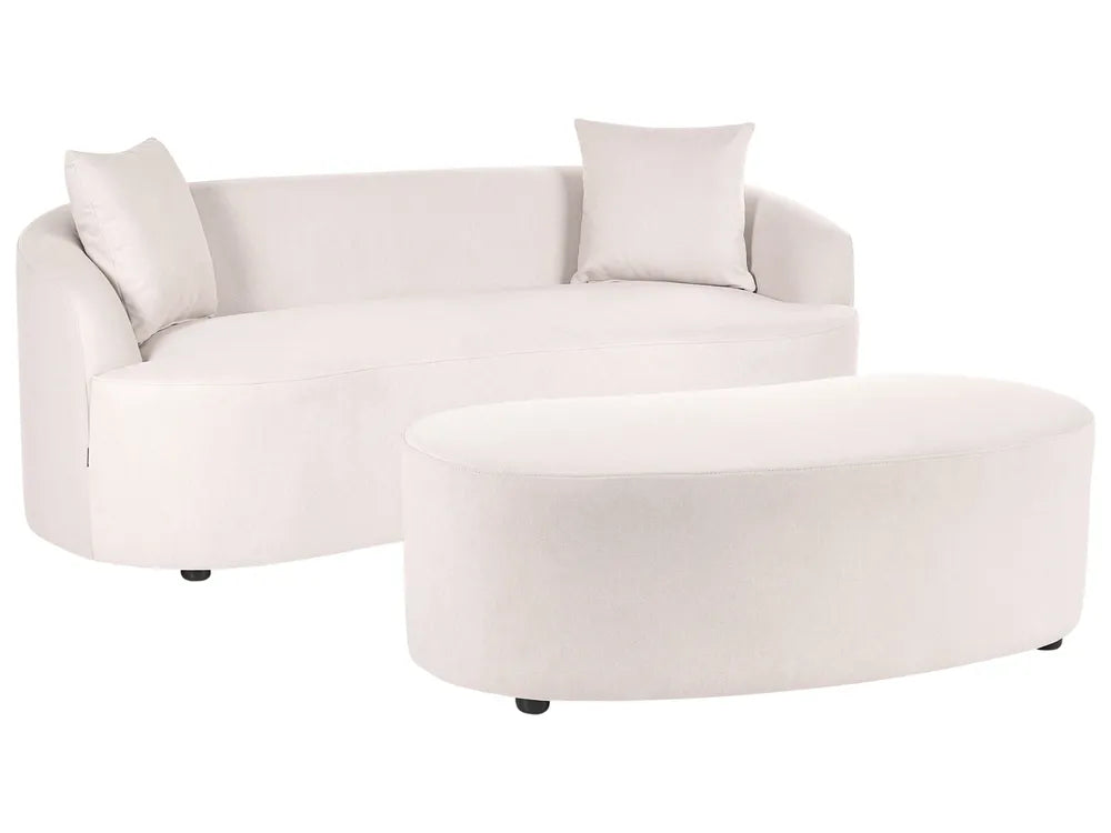 A modern curved white fabric sofa with two matching throw pillows and a matching oval ottoman, shown on a plain white background.