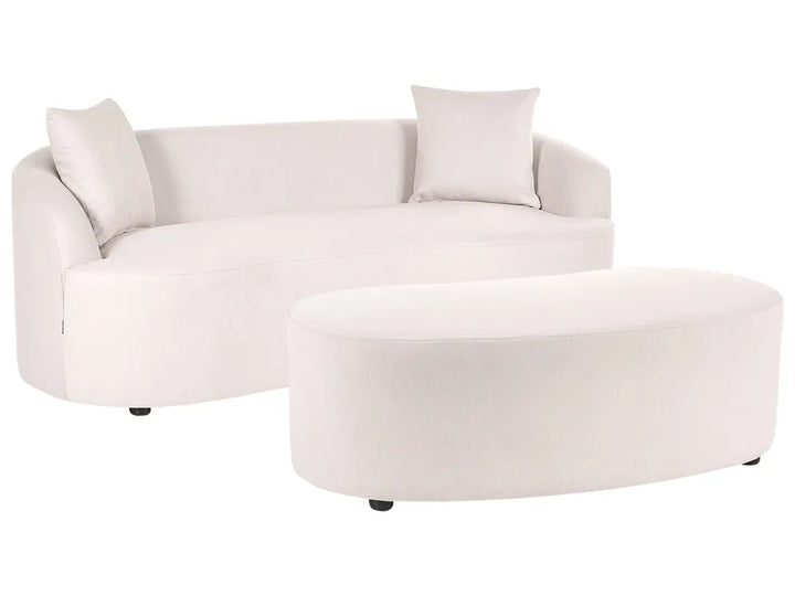 A modern curved white fabric sofa with two matching throw pillows and a matching oval ottoman, shown on a plain white background.