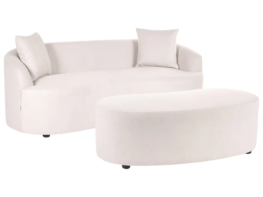 A modern curved white fabric sofa with two matching throw pillows and a matching oval ottoman, shown on a plain white background.