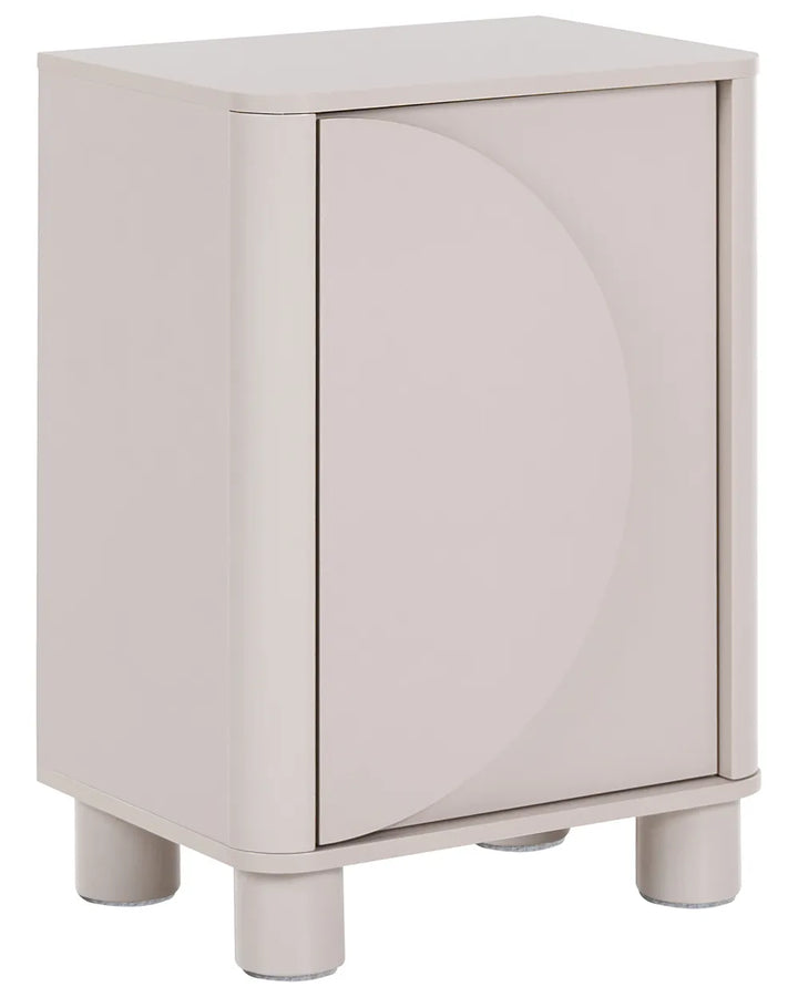A modern side cabinet with a single door featuring a large circular recessed design, finished in a light warm gray or greige color, supported by four cylindrical legs.